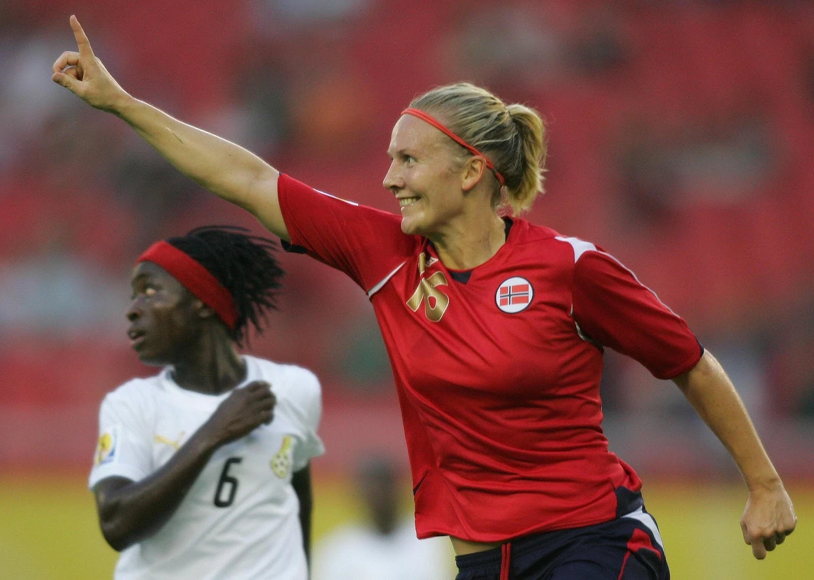 Norway's Ragnhild Gulbrandsen celebrates scoring her team's second goal as Ghana's Florence Okoe looks on in 2007.