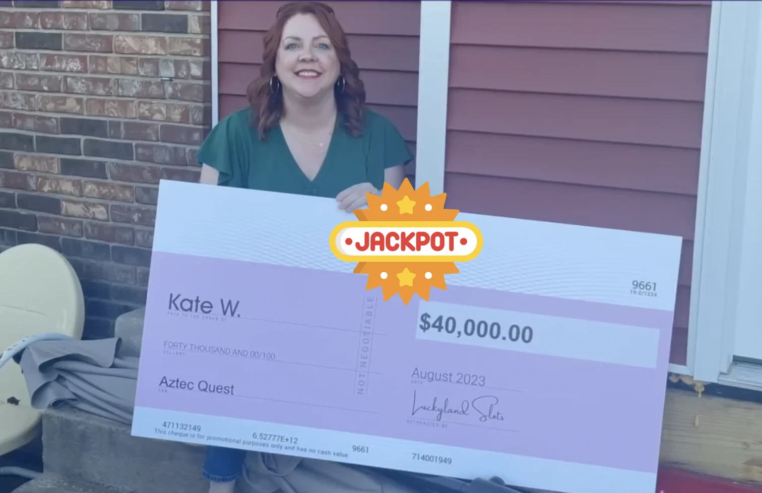 Kate W. holding a check with the amount of money she won playing casino games online.